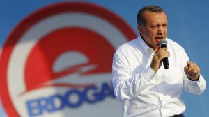 Turkey's Prime Minister and presidential candidate Tayyip Erdogan addresses his supporters during an election rally in Istanbul August 3, 2014. Cheers erupted from the packed stands when Erdogan scored his third goal in a celebrity soccer match to mark the opening of an Istanbul stadium. His orange jersey bore the number 12, a reminder of Erdogan's ambition to become the nation's 12th president in Turkey's first popular vote for its head of state, on Aug. 10. After dominating Turkish politics for more than a decade, few doubt Erdogan will beat his main rival Ekmeleddin Ihsanoglu, a diplomat with little profile in domestic politics, or Selahattin Demirtas, a young Kurdish hopeful. Picture taken August 3, 2014. REUTERS/Murad Sezer (TURKEY - Tags: POLITICS ELECTIONS PROFILE)